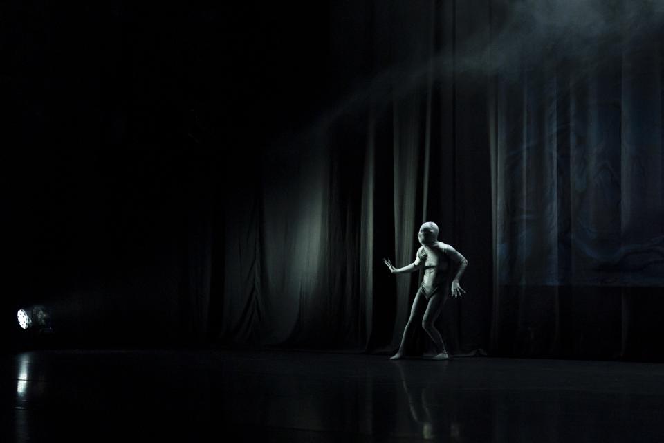 A dancer in a skeleton bodysuit