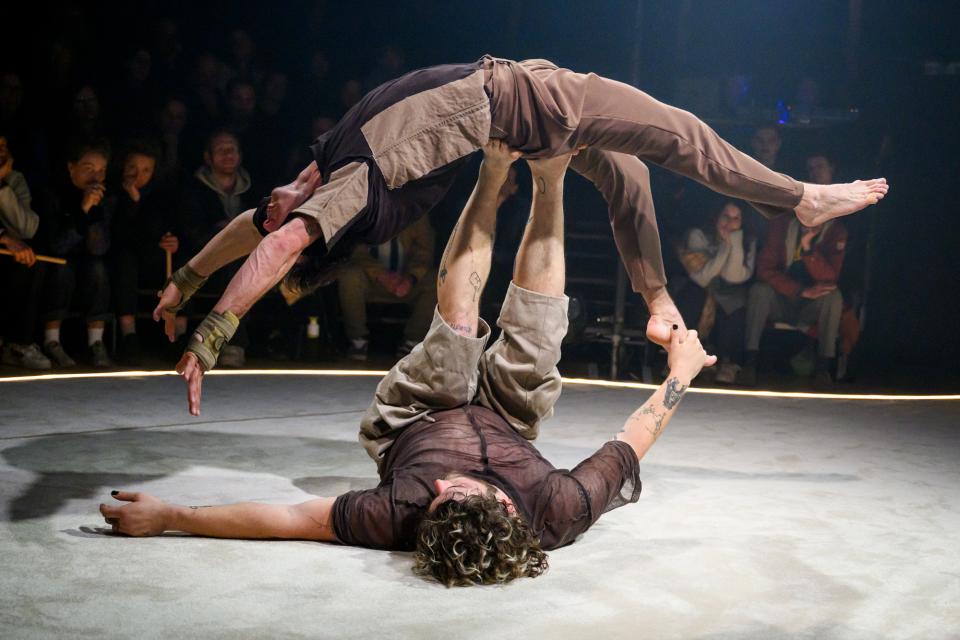 two acrobats on stage